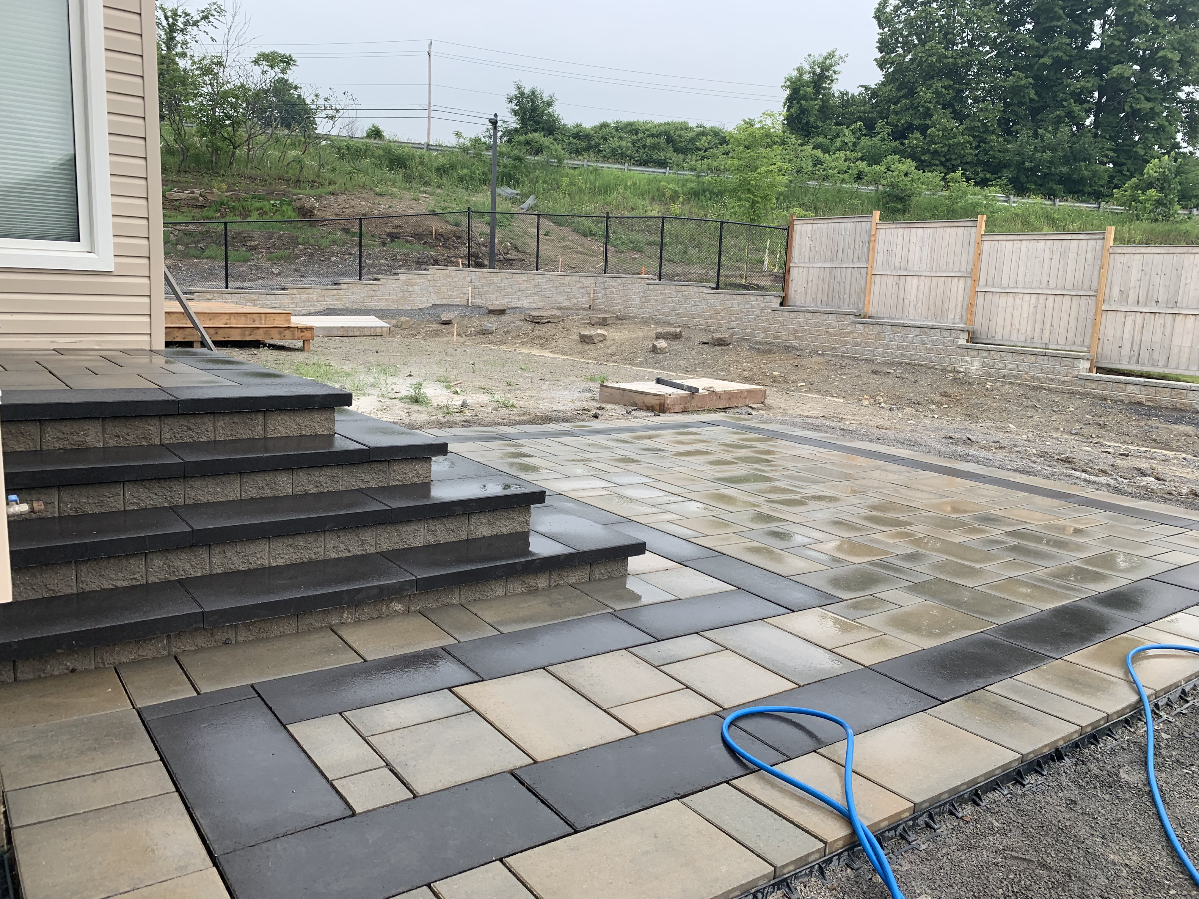 Backyard patio dark accent steps